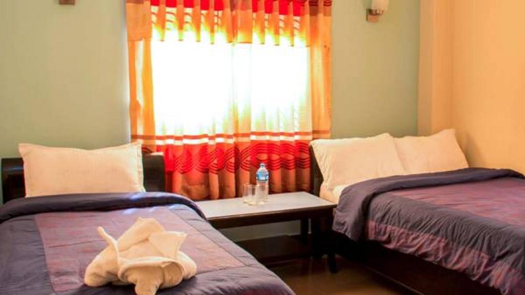 Hotel Atrium Pokhara Quarto foto